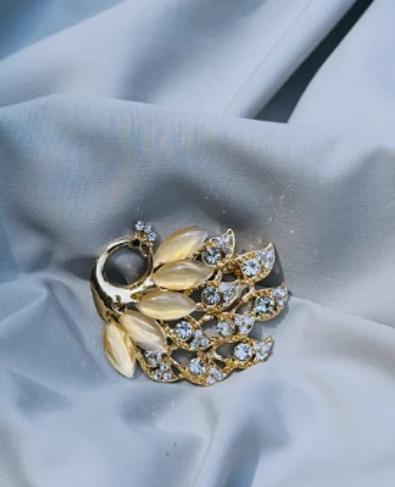 Leaf and feather brooch with opal-look stones